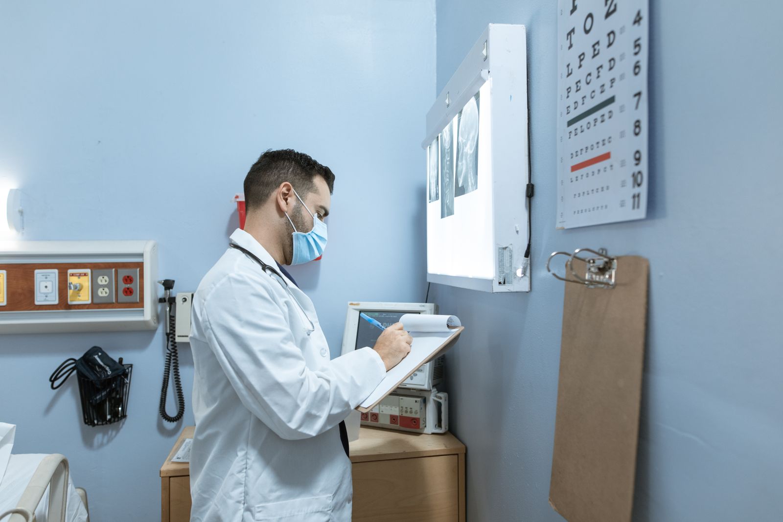 Doctor writing medical notes